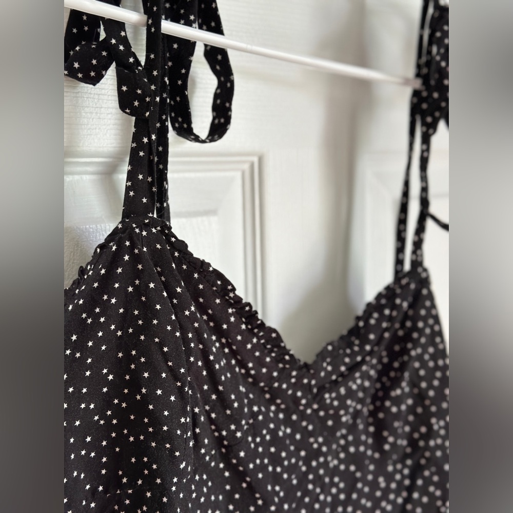 Primark , size 16, black mini dress with star pattern and ruffles on bust line